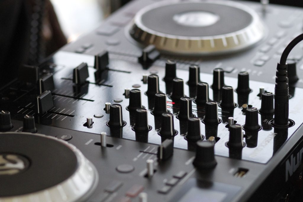 Detailed view of a professional audio mixing console with knobs and controls for sound engineering.